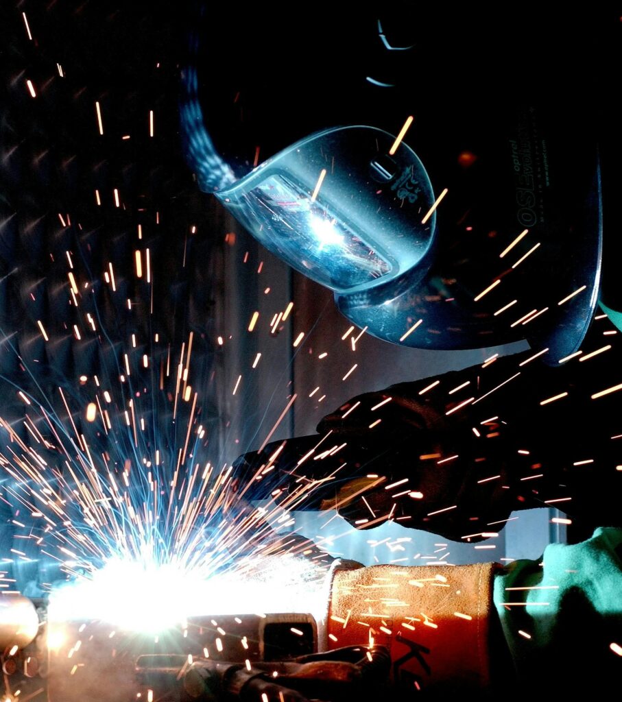weld hot soldering radio welder 73833 73833 A focused welder works with metal in an industrial setting, creating vibrant sparks.